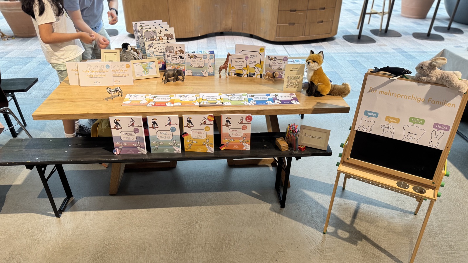 A family coloring and browsing books at Potsdamer Platz