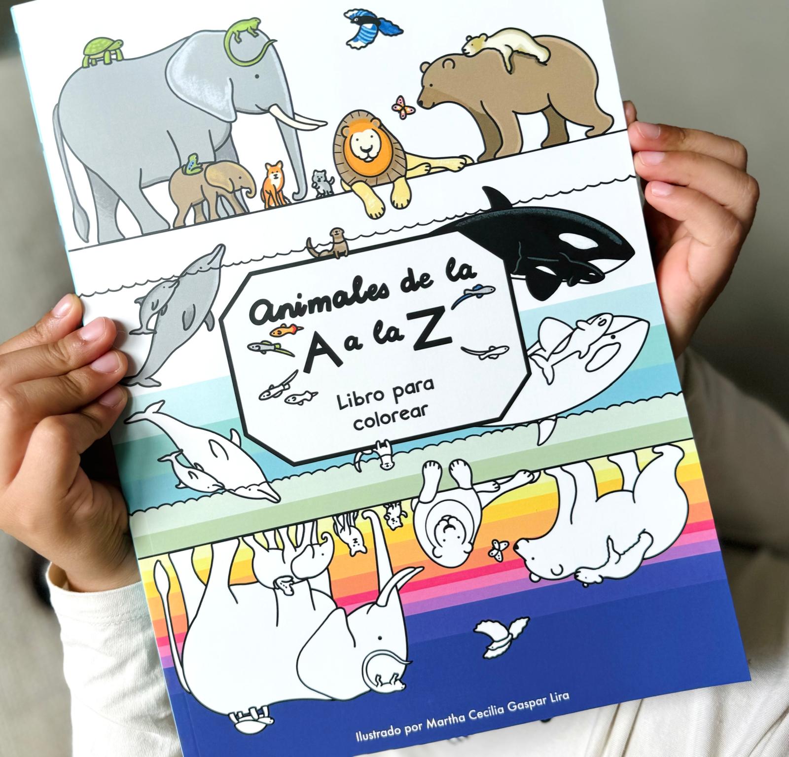 A child holding the Animals from A to Z coloring book